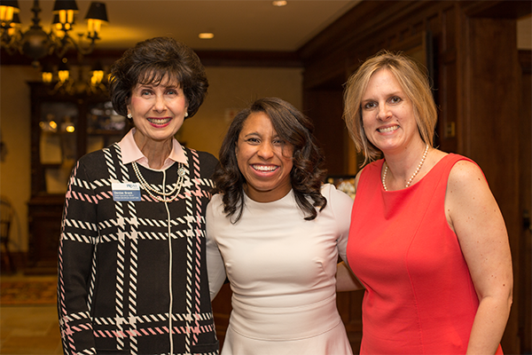 Three PRSA members smiling at the camera